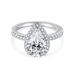 CARISSIE pear cut moissanite ring, top-down view on white background displaying the full symmetry of the halo and split shank design