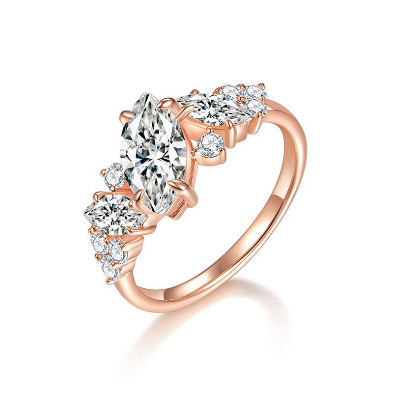 CARISSIE marquise moissanite engagement ring in rose gold, studio shot against white background showing intricate leaf accents