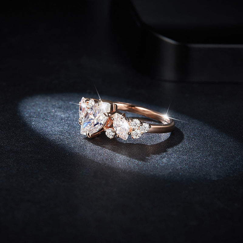CARISSIE marquise moissanite engagement ring in rose gold, side profile highlighting the organic vine-like stone arrangement