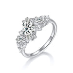 CARISSIE marquise moissanite engagement ring in silver-tone metal, three-quarter angle showcasing the bright finish and floral design