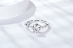 CARISSIE oval moissanite solitaire ring, top-down perspective showcasing the symmetrical vine-like band design