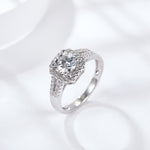 CARISSIE round moissanite halo ring, three-quarter angle capturing the sparkle of the geometric halo setting