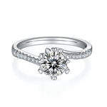 CARISSIE round moissanite solitaire ring, top-down view highlighting the brilliant cut center stone and symmetrical pave details