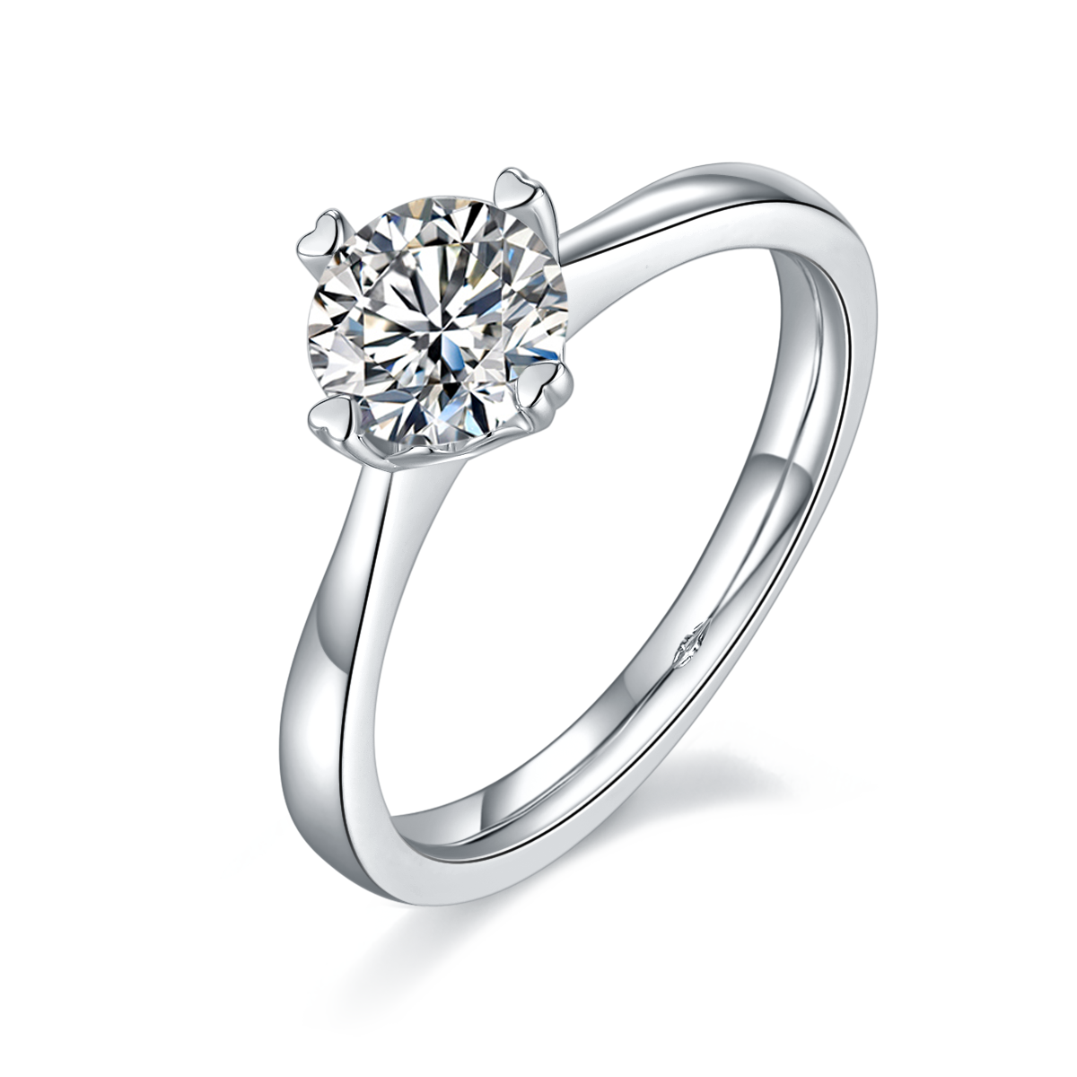 CARISSIE round moissanite solitaire ring, angled view highlighting heart-shaped prongs and polished silver-tone band
