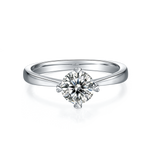 CARISSIE round moissanite solitaire ring, top-down perspective displaying brilliant cut facets and four-prong setting