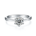 CARISSIE round moissanite solitaire ring, top-down perspective showing the brilliant-cut center stone and smooth metal shank