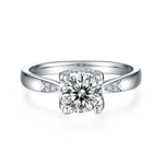 CARISSIE round moissanite solitaire ring, front view highlighting brilliant center stone in four-prong silver-tone setting