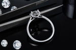 CARISSIE round moissanite solitaire ring, side profile revealing inner gallery details and S925 stamp on polished band