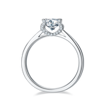 CARISSIE round moissanite solitaire ring, top-down angle displaying circular band shape and diamond halo around center