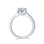 CARISSIE round moissanite solitaire ring, top-down view displaying the polished silver-tone band and inner circle