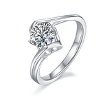 CARISSIE round moissanite tension ring, angled view highlighting the split band design and brilliant-cut center stone