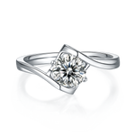 CARISSIE round moissanite engagement ring, top-down perspective showing the open setting and polished silver-tone finish