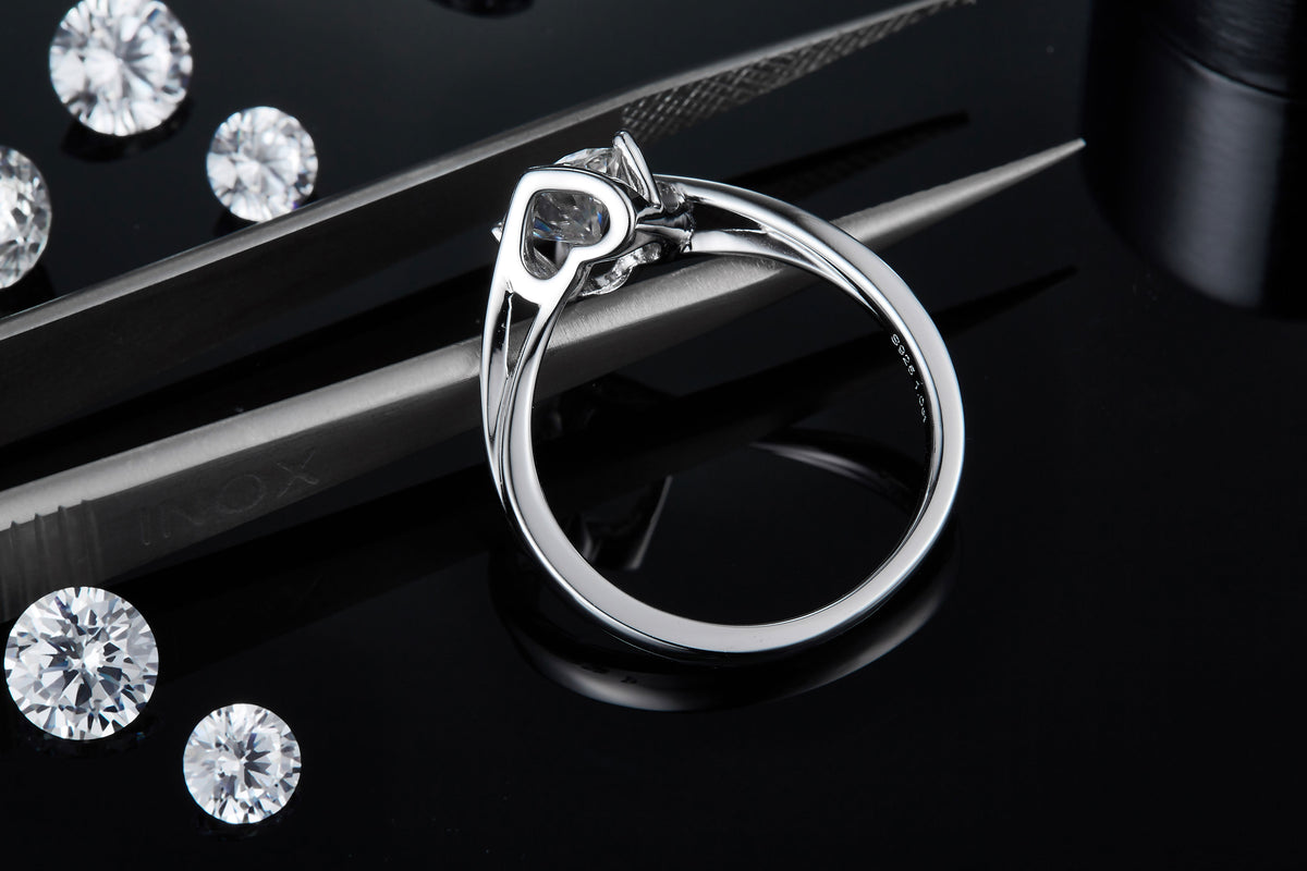 CARISSIE round moissanite tension ring, detailed side angle revealing the inner band stamping and precise craftsmanship