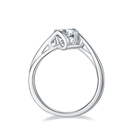 CARISSIE round moissanite solitaire ring, side profile displaying the curved shank and unique tension-style metalwork