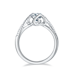 CARISSIE round moissanite bezel ring, side profile revealing the open under-gallery design and smooth silver-tone finish.