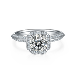CARISSIE round moissanite halo ring, direct front view showcasing the flower-shaped halo and pavé-set split shank.