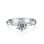 CARISSIE round moissanite solitaire ring, front view highlighting six-prong setting and polished silver-tone metal finish