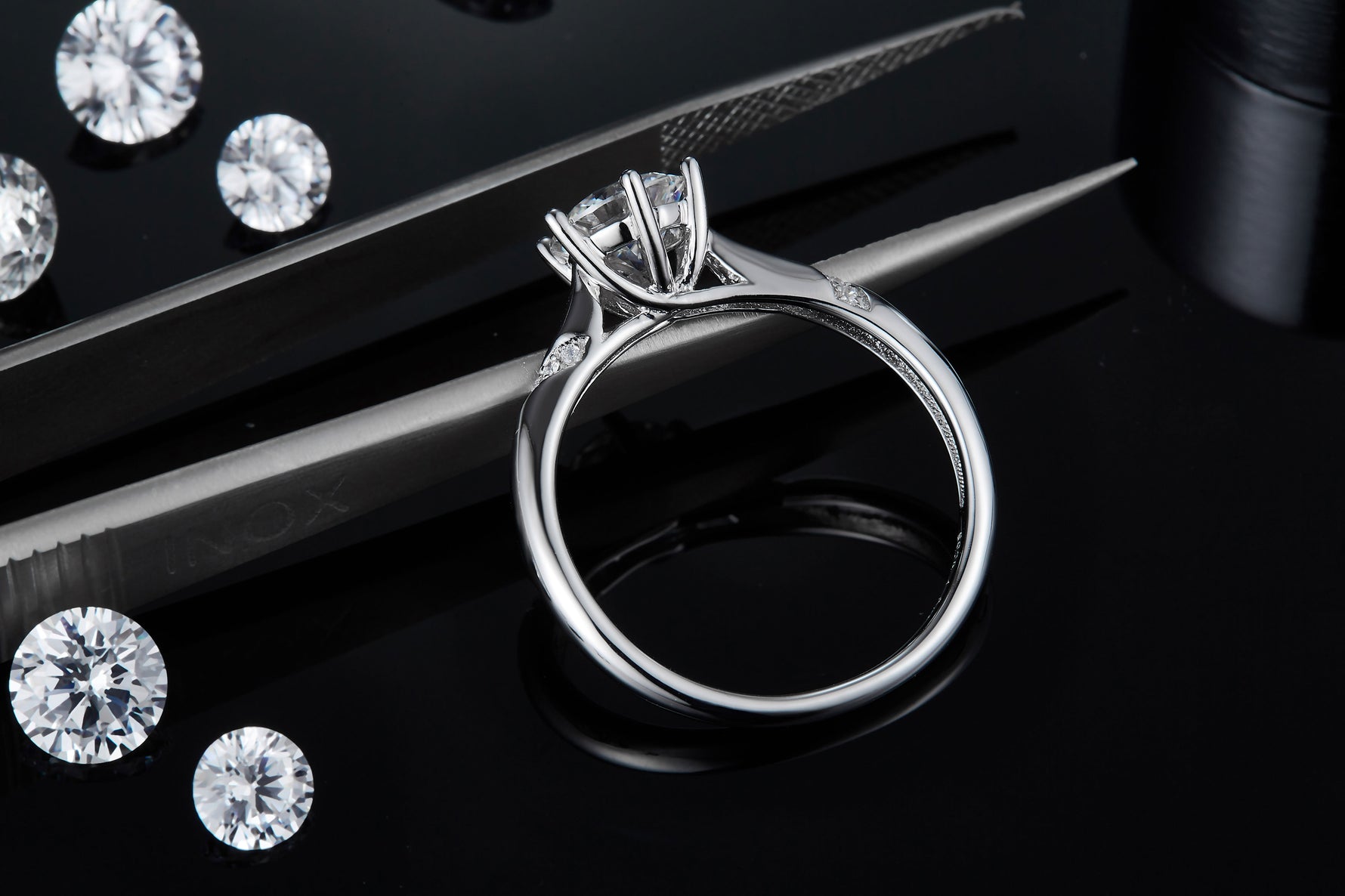 CARISSIE round moissanite solitaire ring, side profile view revealing inner band texture and secure six-prong head construction
