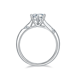 CARISSIE round moissanite solitaire ring, top-down view displaying the elegant arch of the split shank and prong details