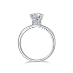 CARISSIE round moissanite solitaire ring, side profile showing the gallery rail accent stones and prong structure