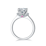 CARISSIE round moissanite solitaire ring, side profile revealing inner gallery structure and small pink gemstone