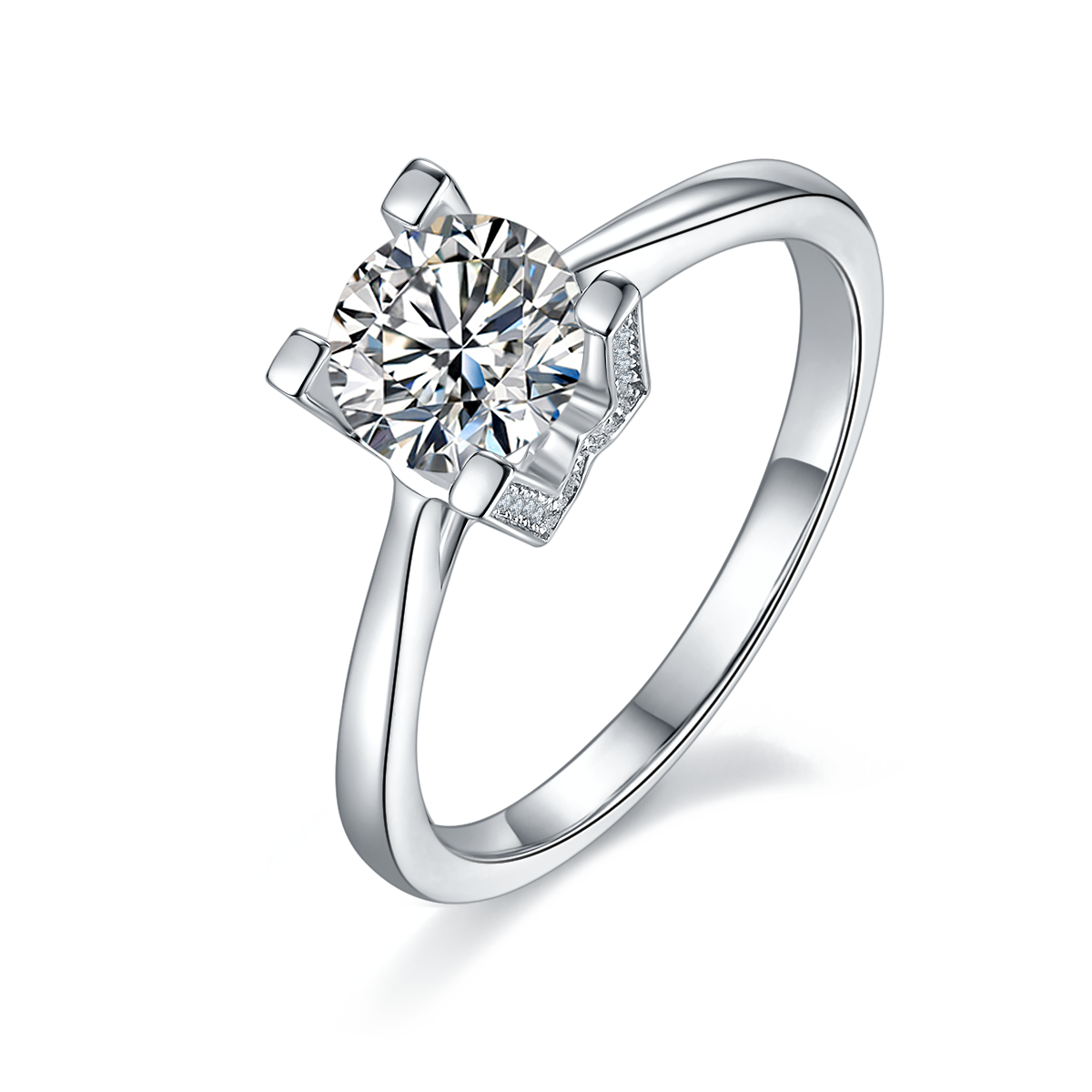 CARISSIE round moissanite solitaire ring, angled view highlighting the geometric H-shaped prongs and pavé accents on a white background