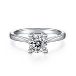 CARISSIE round moissanite solitaire ring, direct front view showcasing the brilliant cut center stone and sleek polished silver-tone band