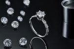 CARISSIE round moissanite solitaire ring, side profile on black background displaying the high setting height and tapered trapezoidal details