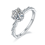 CARISSIE round moissanite solitaire ring, angled view highlighting Art Deco geometric band segments and channel-set accent stones
