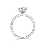 CARISSIE round moissanite solitaire ring, top-down view displaying the continuous faceted pattern along the silver shank