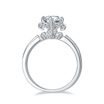 CARISSIE round moissanite solitaire ring, gallery view revealing the unique pavé-set fleur-de-lis motif beneath the head