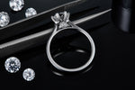 CARISSIE round moissanite solitaire ring, back view displaying open gallery design and structural support of the head