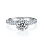 CARISSIE round moissanite solitaire ring, front view displaying the brilliant center stone and crown setting