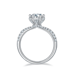 CARISSIE round moissanite solitaire ring, top-down view highlighting the flower-shaped basket and inner shank