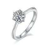 CARISSIE round moissanite solitaire ring, angled view highlighting beaded band texture and six-prong setting