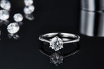 CARISSIE round moissanite solitaire ring, reflective surface view showcasing the vintage-inspired beaded shank