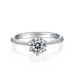 CARISSIE round moissanite solitaire ring, front perspective showing the brilliant center stone and milgrain detail
