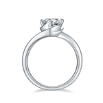 CARISSIE round moissanite solitaire ring, bottom profile view revealing smooth interior of the polished silver metal band
