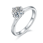 CARISSIE round moissanite solitaire ring, angled view showing split shank band and brilliant center stone