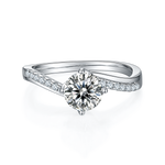 CARISSIE round moissanite solitaire ring, front view showcasing the brilliant center stone held by four prongs on a split band
