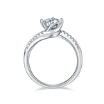 CARISSIE round moissanite solitaire ring, side profile showing the height of the setting and the row of small accent stones along the band