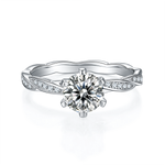 CARISSIE round moissanite solitaire ring, front view highlighting the brilliant center stone and vine-like shoulders