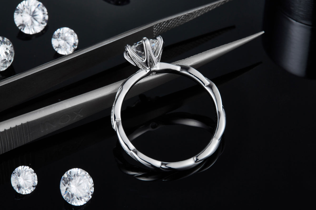 CARISSIE round moissanite solitaire ring, top-down view revealing the interior smoothness and exterior wave texture