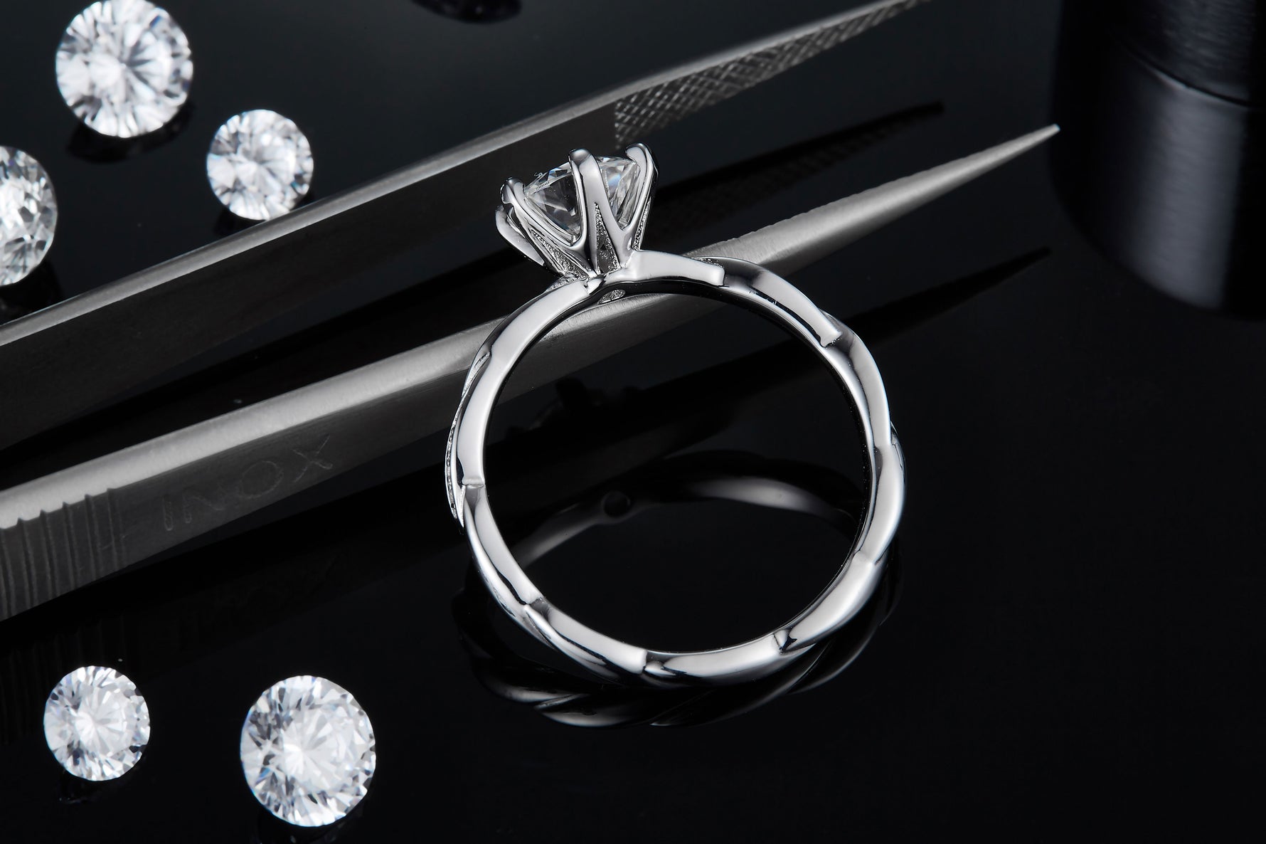 CARISSIE round moissanite solitaire ring, top-down view revealing the interior smoothness and exterior wave texture
