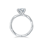 CARISSIE round moissanite solitaire ring, side profile displaying the organic undulations of the shank design