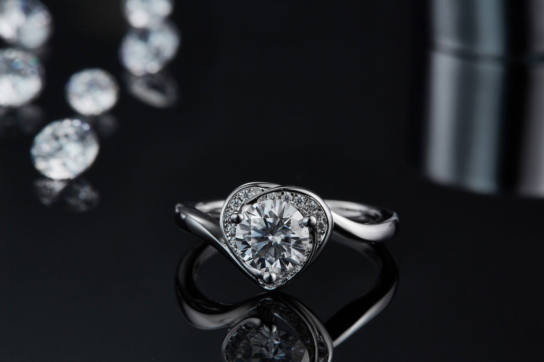 CARISSIE round moissanite engagement ring, close-up front view emphasizing the brilliant cut of the center stone
