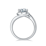 CARISSIE round moissanite engagement ring, side profile revealing the curved silver-tone band and prong height
