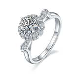 CARISSIE round moissanite halo ring, angled view highlighting the crown-inspired prongs and split-shank band details