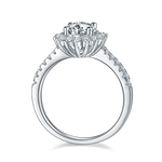 CARISSIE round moissanite halo engagement ring, side profile revealing the cathedral setting and inner gallery structure.