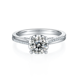 CARISSIE round moissanite solitaire ring, front view highlighting the four-prong setting and sparkling center gemstone